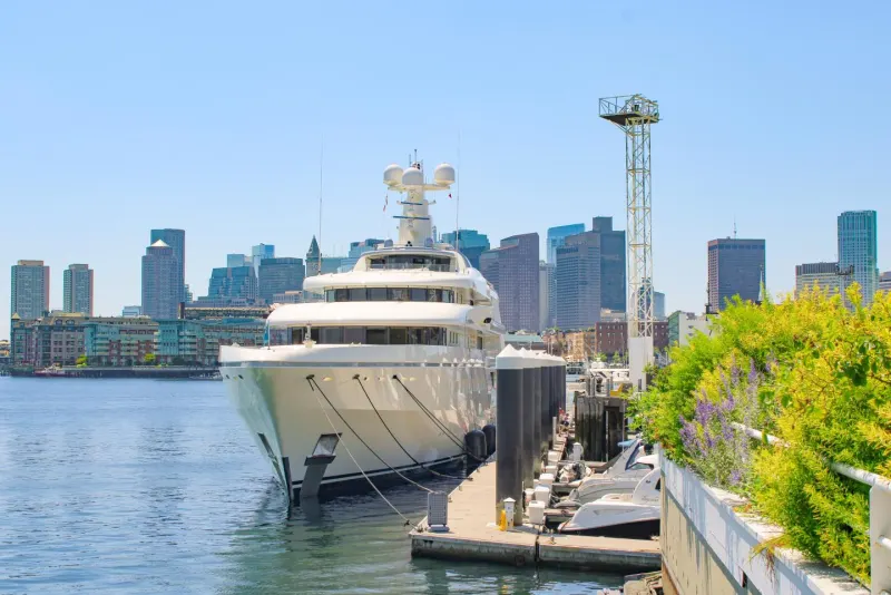 Superyacht berthed with the Boston skyline behind