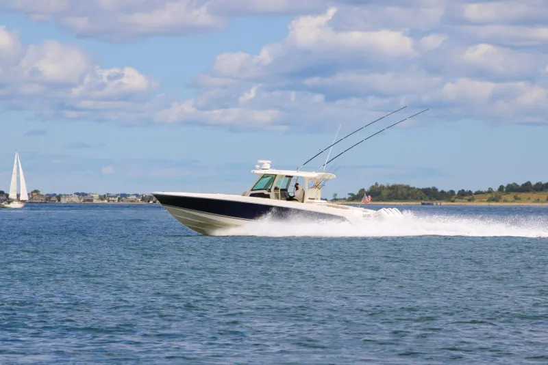 Motor yacht running through Boston Harbor