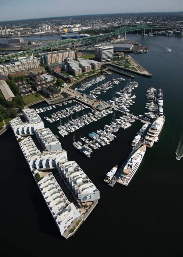 Aerial of docks with the Boston skyline beyond