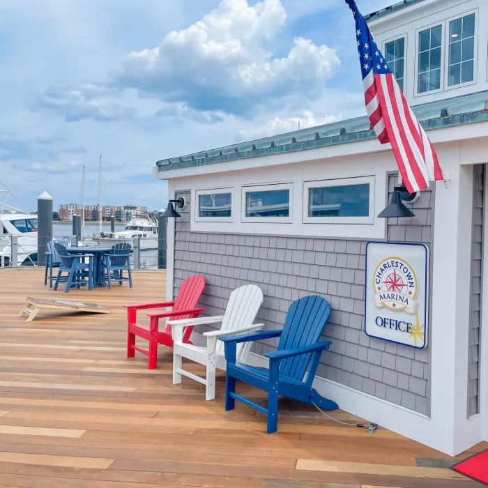 Marina office deck with Adirondack chairs and an American flag
